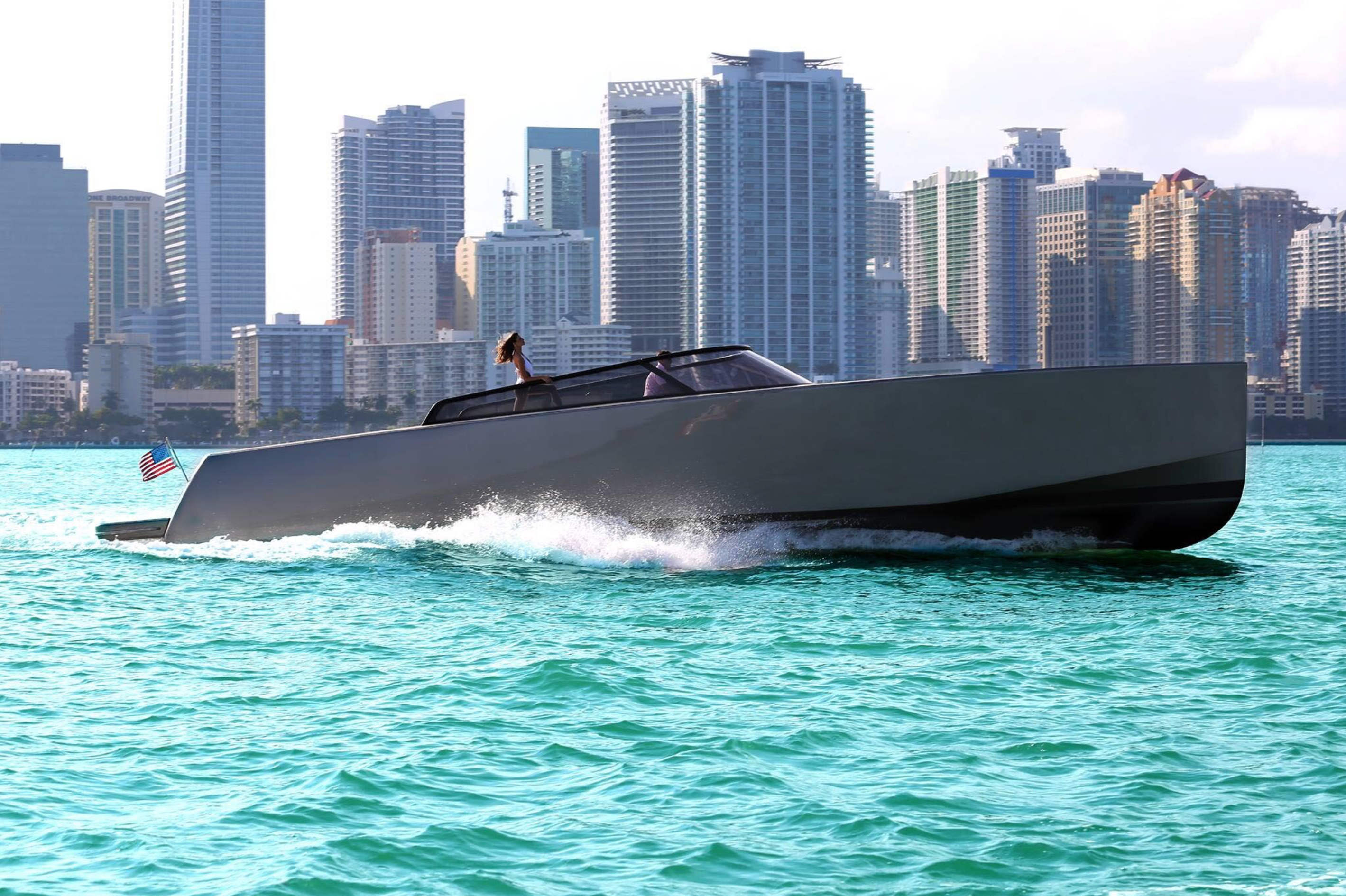 Speedboat cruising past the Miami skyline on Biscayne Bay